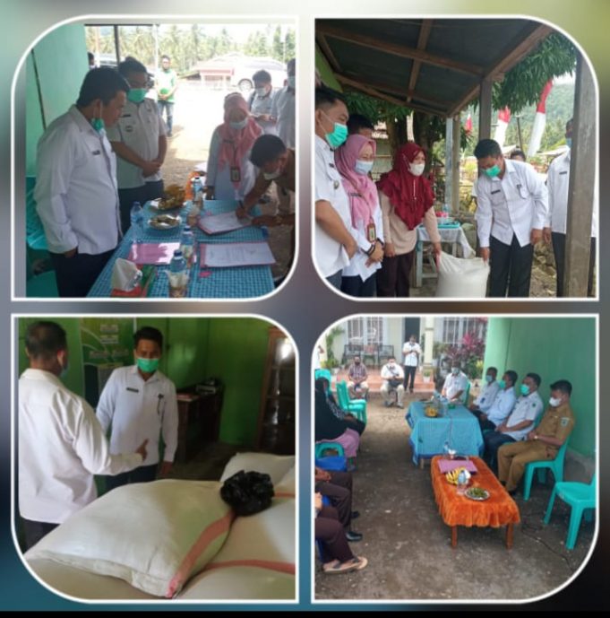 Sekda Bolmong Serahkan Bantuan Pengisian Lumbung Pangan Desa