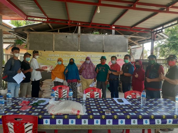 Pemkab Bolmong Salurkan Bantuan PKH dan BST